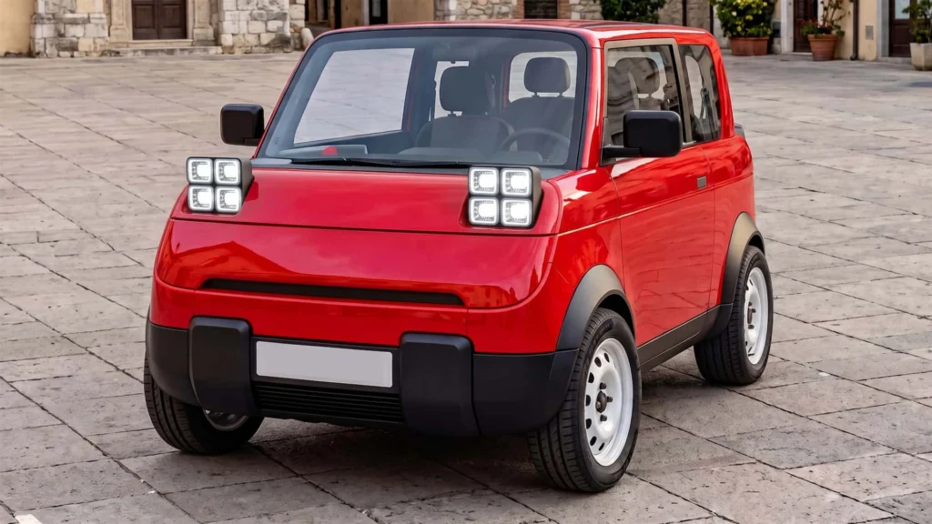 Malé červené elektrické auto spredu na dlažbe námestia